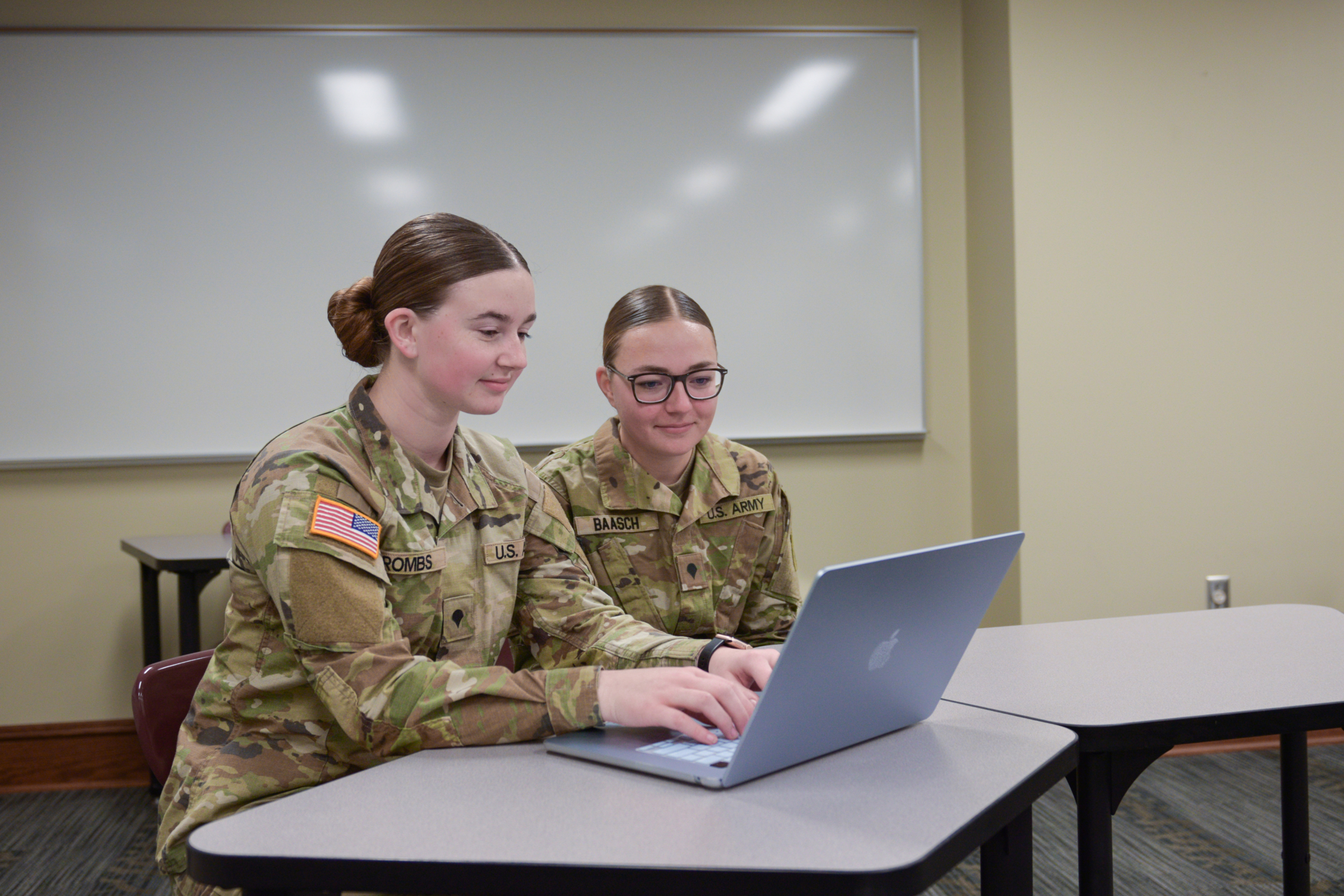 Jaydin and other student working on computer in class