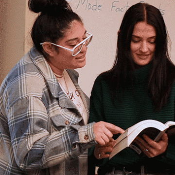 Two students do English homework together in class at VCSU