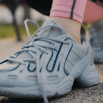 individual tying their shoe