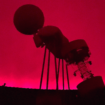 The planetarium at Valley City State University changing from red light to darkness