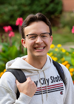 Headshot of Garret Fettig outside a dorm