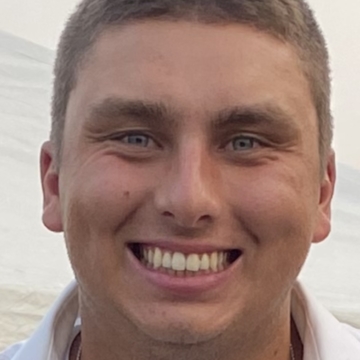 Photo of Grant Inniger smiling at the camera