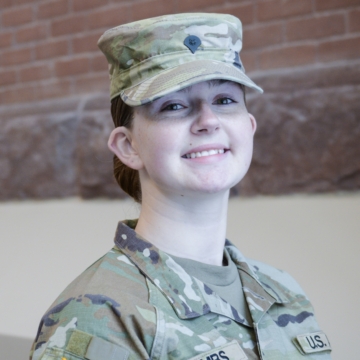 Photo of Jaydin Rombs smiling at the camera