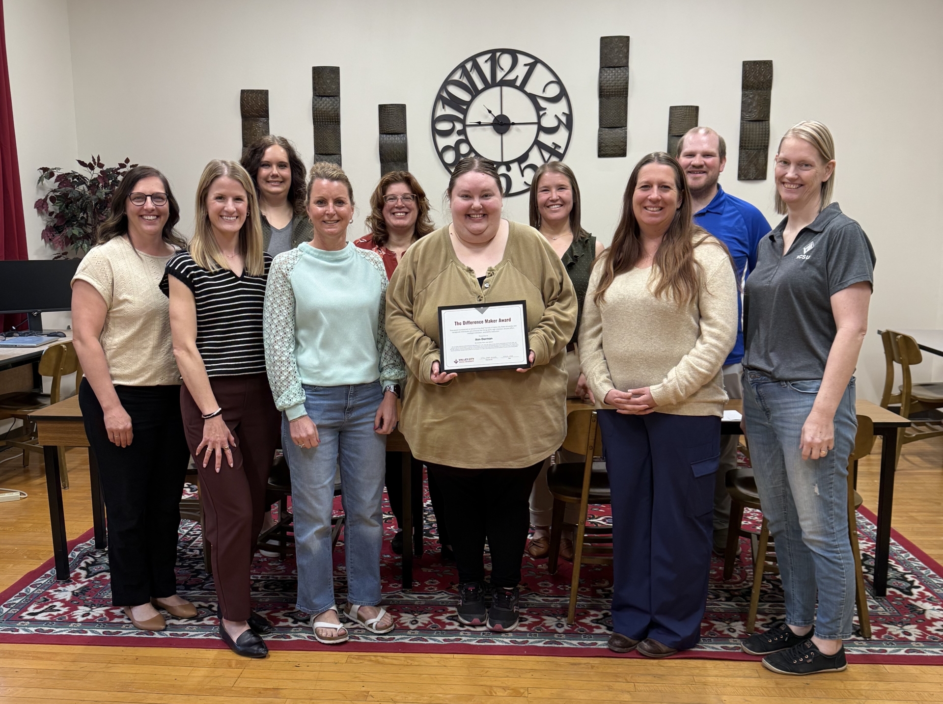 Ann Dorman receiving award from colleagues