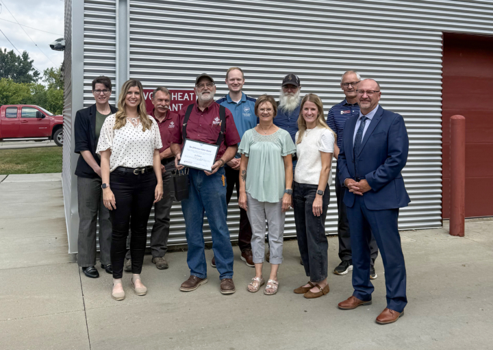 Chuck Bowen receiving award from colleagues