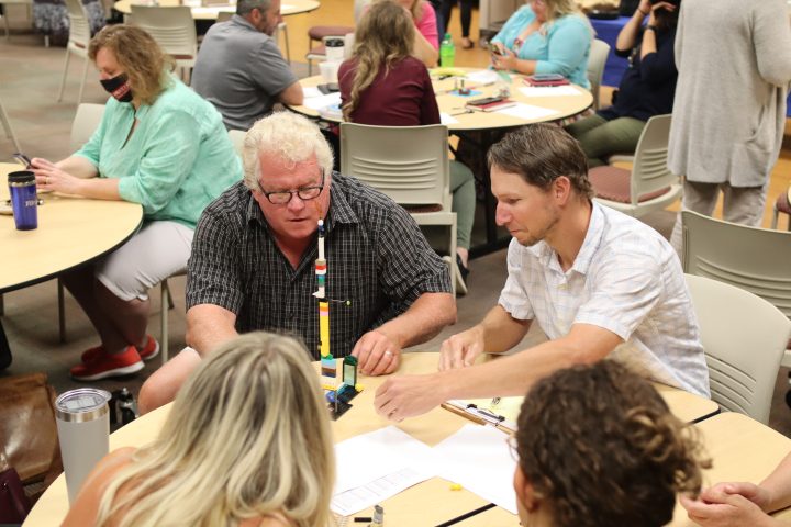 Employees participating in strategic plan lego activity