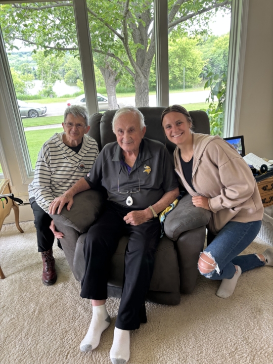 Photo of Kathleen Vetter with her grandparents smiling at the camera