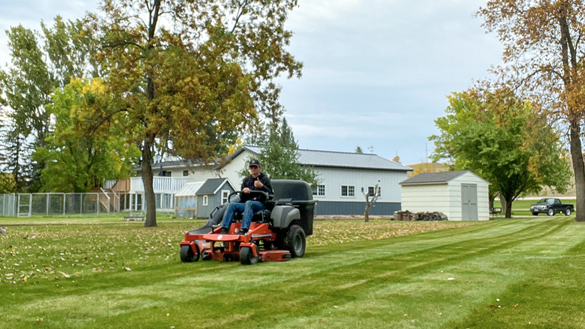 Derek Bear mowing lawns 
