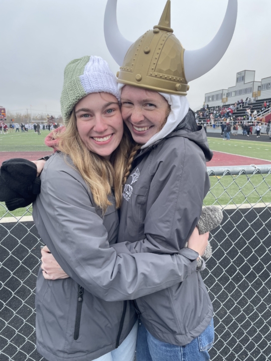 Tara Dahl and friend outside a football game. Friend is wearing a Viking helmet