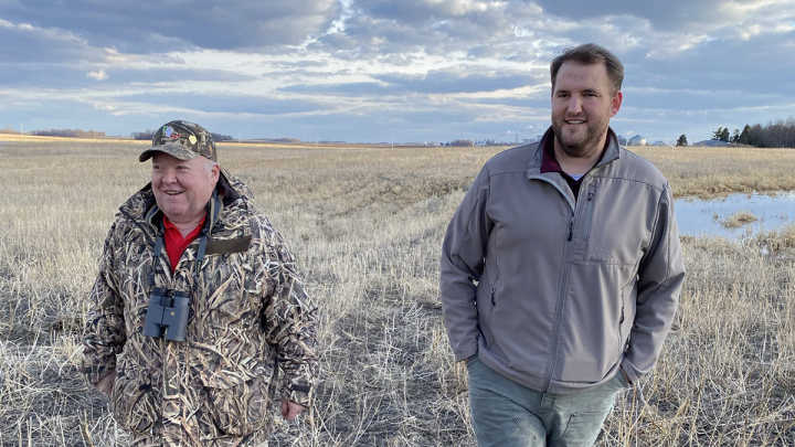 John Lindstrom, right, showing a Ducks Unlimited supporter restored wetlands in Minnesota