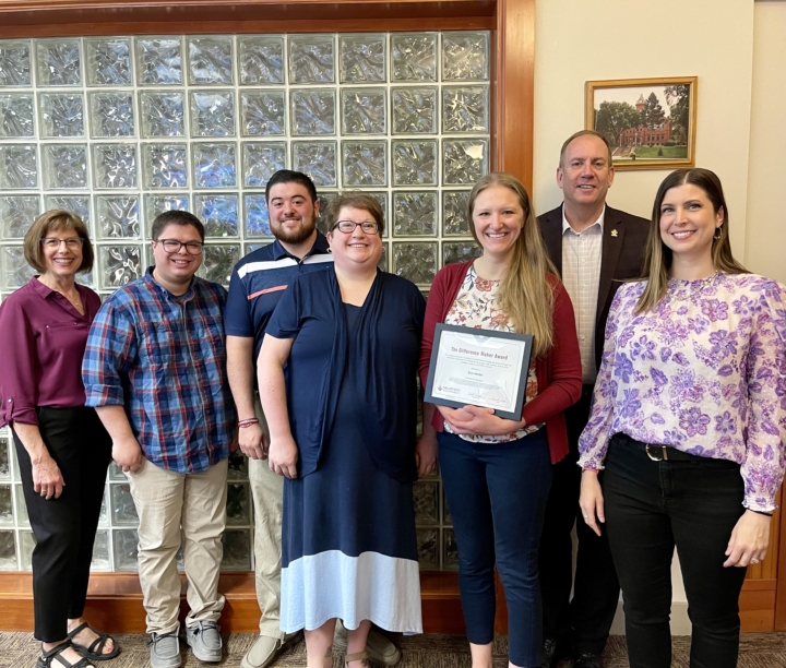 Erin Heide receiving Difference Maker award