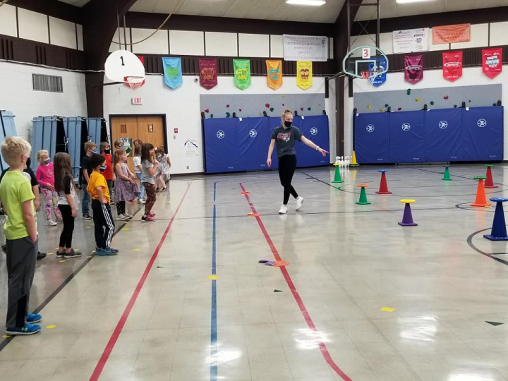 Student teaching at elementary school gymnasium