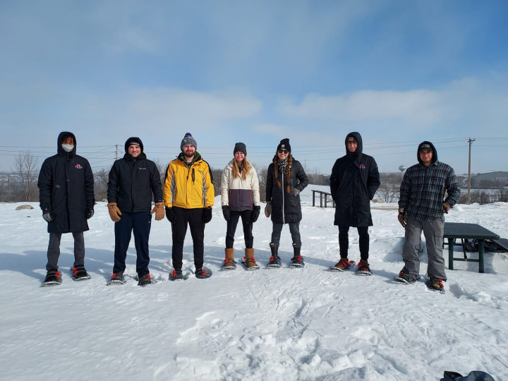 students snow shoeing