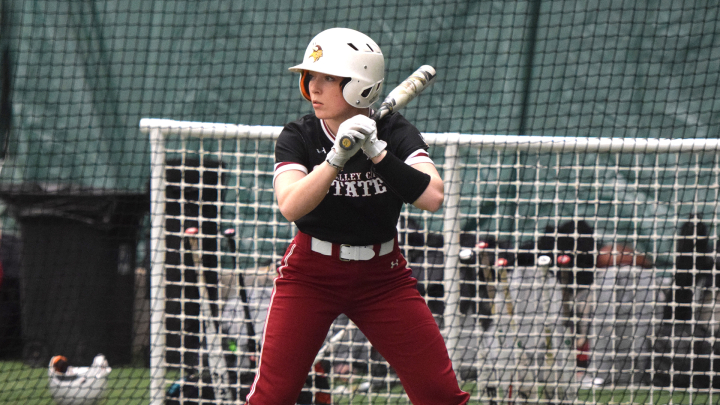 softball player batting