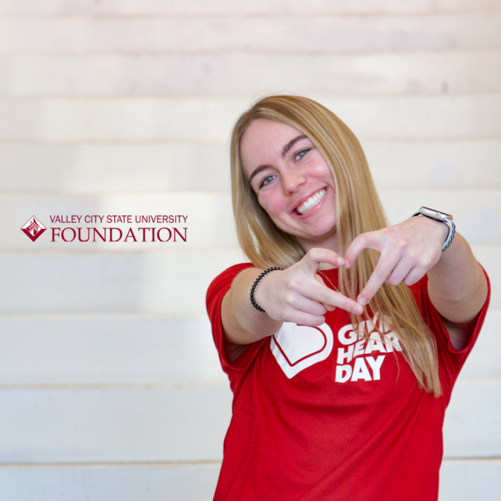 Female student wearing Giving Hearts Day shirt