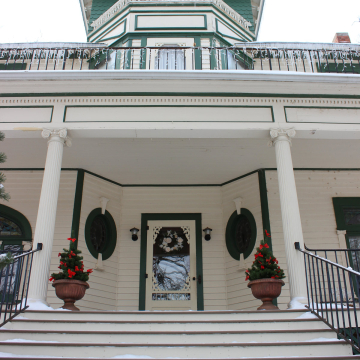 Christmas decorations adorn the front step of the President's House on VCSU campus.