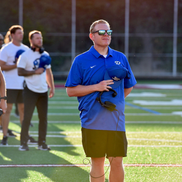 Scott Enyeart standing on sidelines