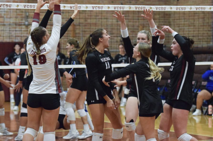 volleyball team celebrating