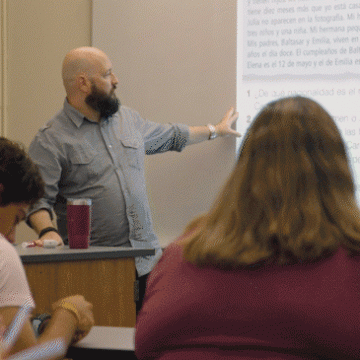 Spanish education professor speaking to a group