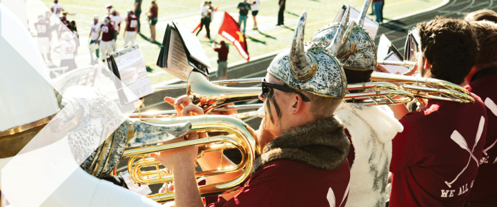 Students playing instruments in the VCSU band at the homecoming football game 