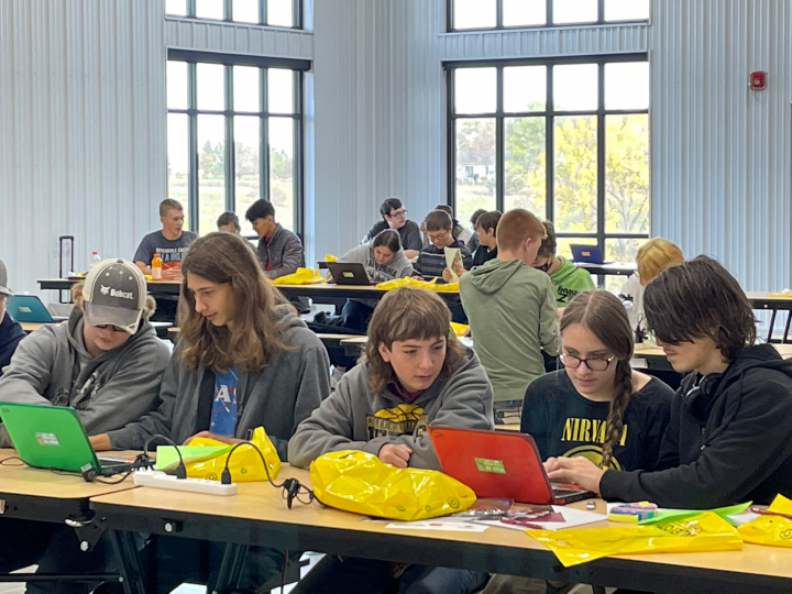 Students participating, using technology