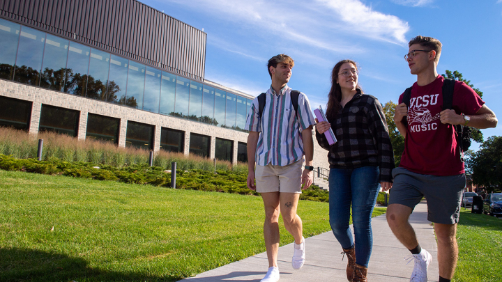 Students walking outside of Center for the Arts