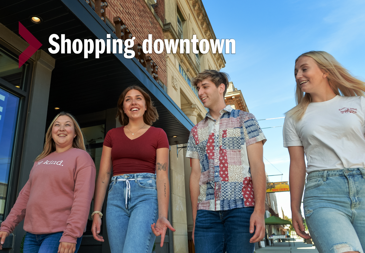Four students walking in downtown Valley City with text that says Shopping Downtown