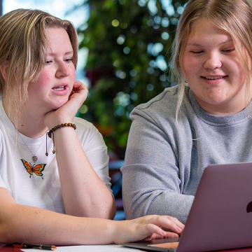 female student tutoring another female student