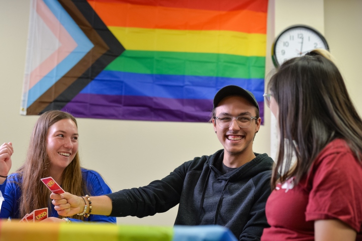 students in diversity lounge playing cards