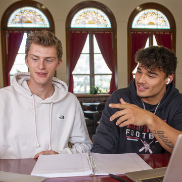 Two male students studying together