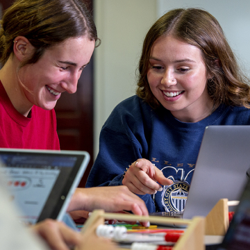 Two female students working on a project together