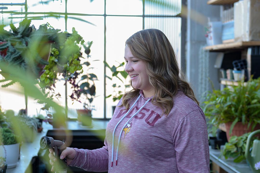 amber watering plants