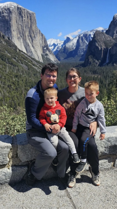 Brittany Evans with her husband Josh and two children. Mountains in background
