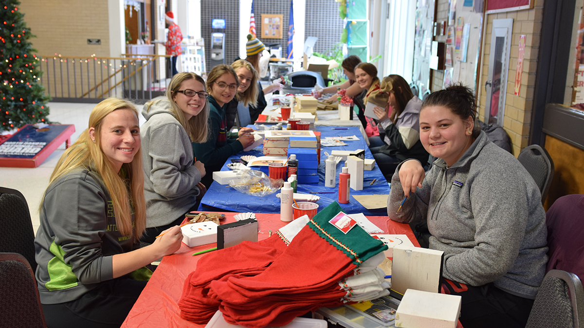 Students creating Christmas decorations in the Student Center.