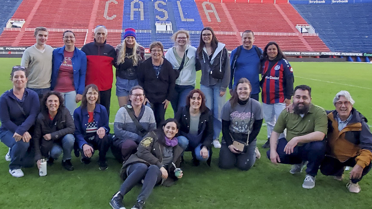 group posing on soccer field