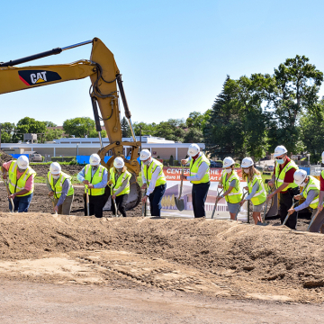 Individuals in hard hats with shovels participating in the groundbreaking ceremony for the new VCSU Center for the Arts