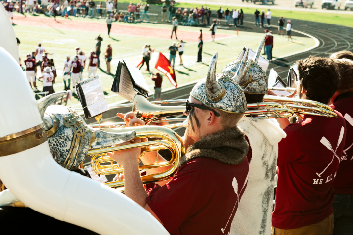 students playing instruments during football game