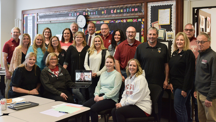 A group of faculty and staff with Joan Klien