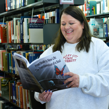 Photo of Kimberly Souba reading her book
