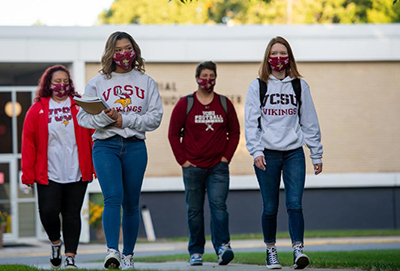 masked students outside student center