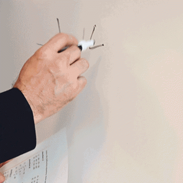 Teacher writing an equation on the white board.