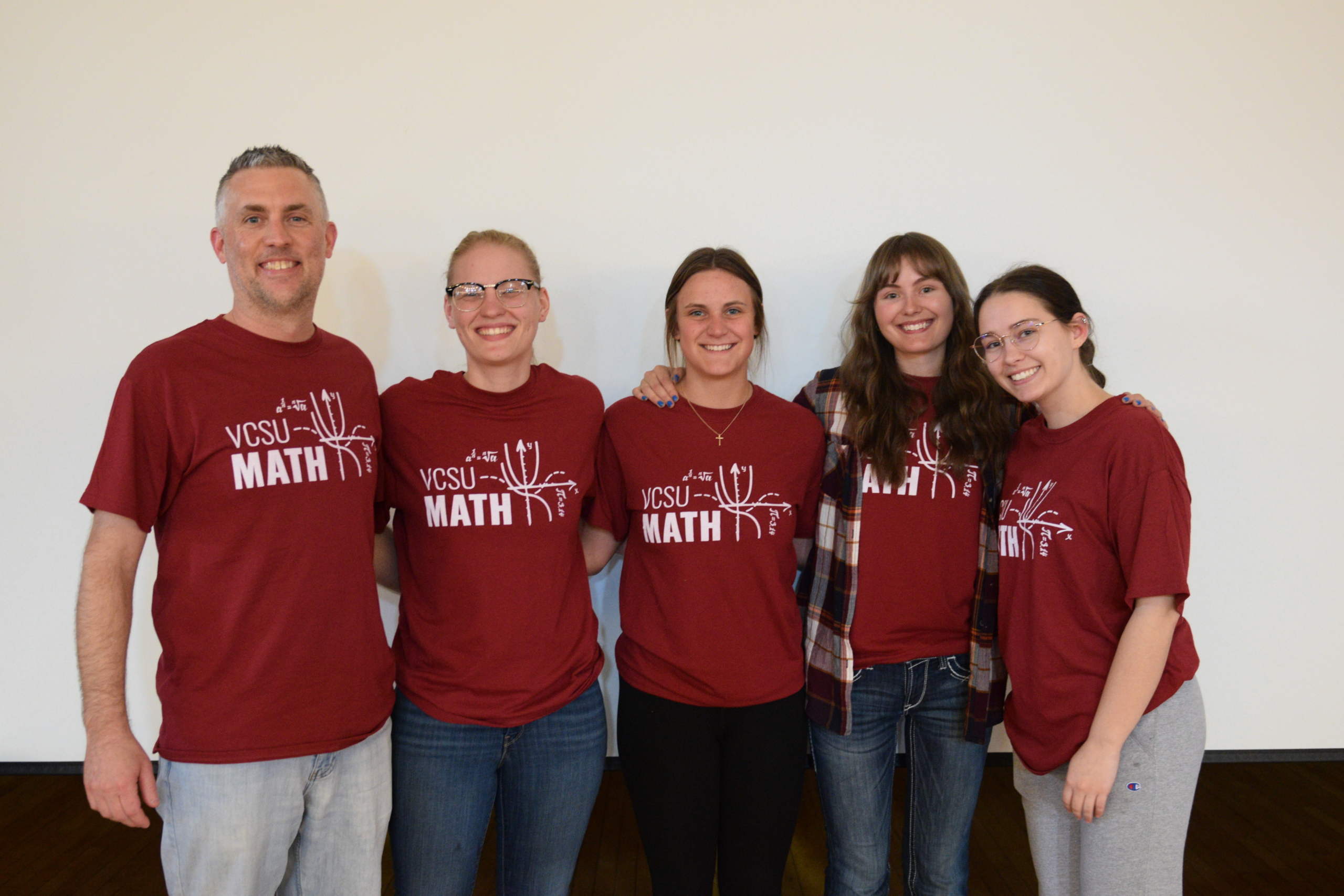 group of 4 math students with professor