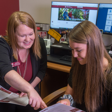 Admissions Counselor with student