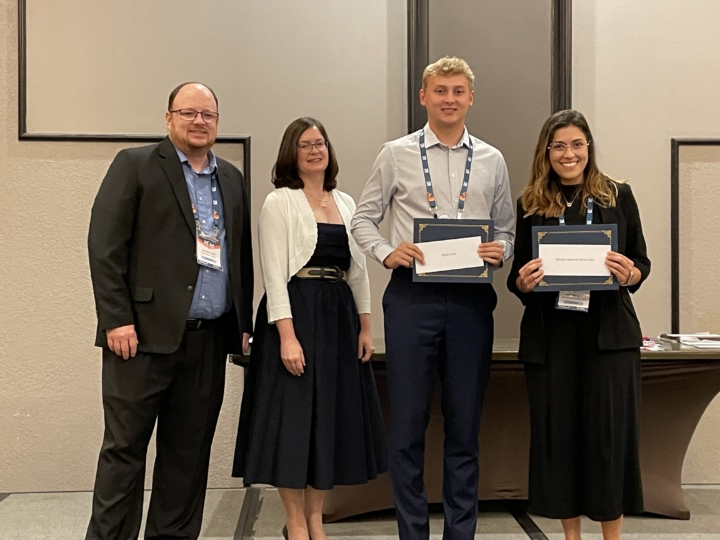 Peyton Zaun with award and group of other recipients