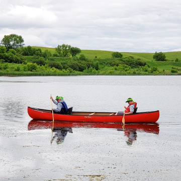 People paddling in canoe Clausen Springs