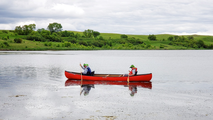 People paddling in canoe Clausen Springs