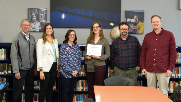 Shannon Hone receiving award from colleagues