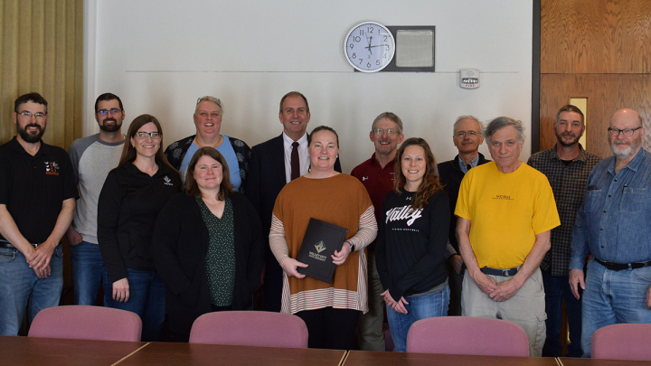 A group of faculty with Teather Sundstrom in the middle.