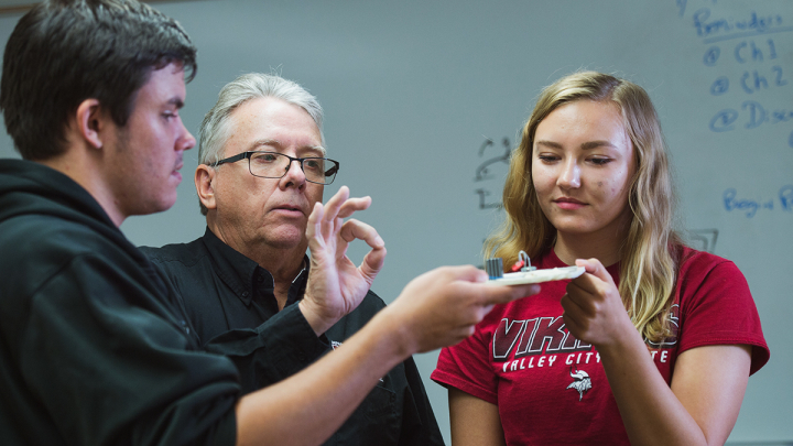 Students working with a Professor