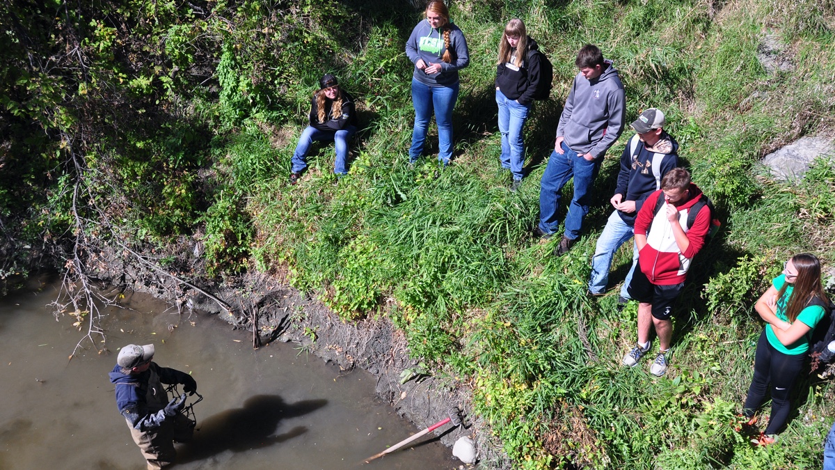 Mammalogy students learning how to set a water-set for trapping beaver. Trapping is an important tool used in wildlife management.